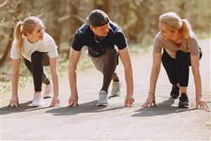 Young men and women set out on a friendly race